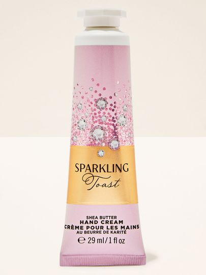 Krem do rąk Sparkling Toast Bath & Body Works w różowo‑złotej tubie z błyszczącą etykietą