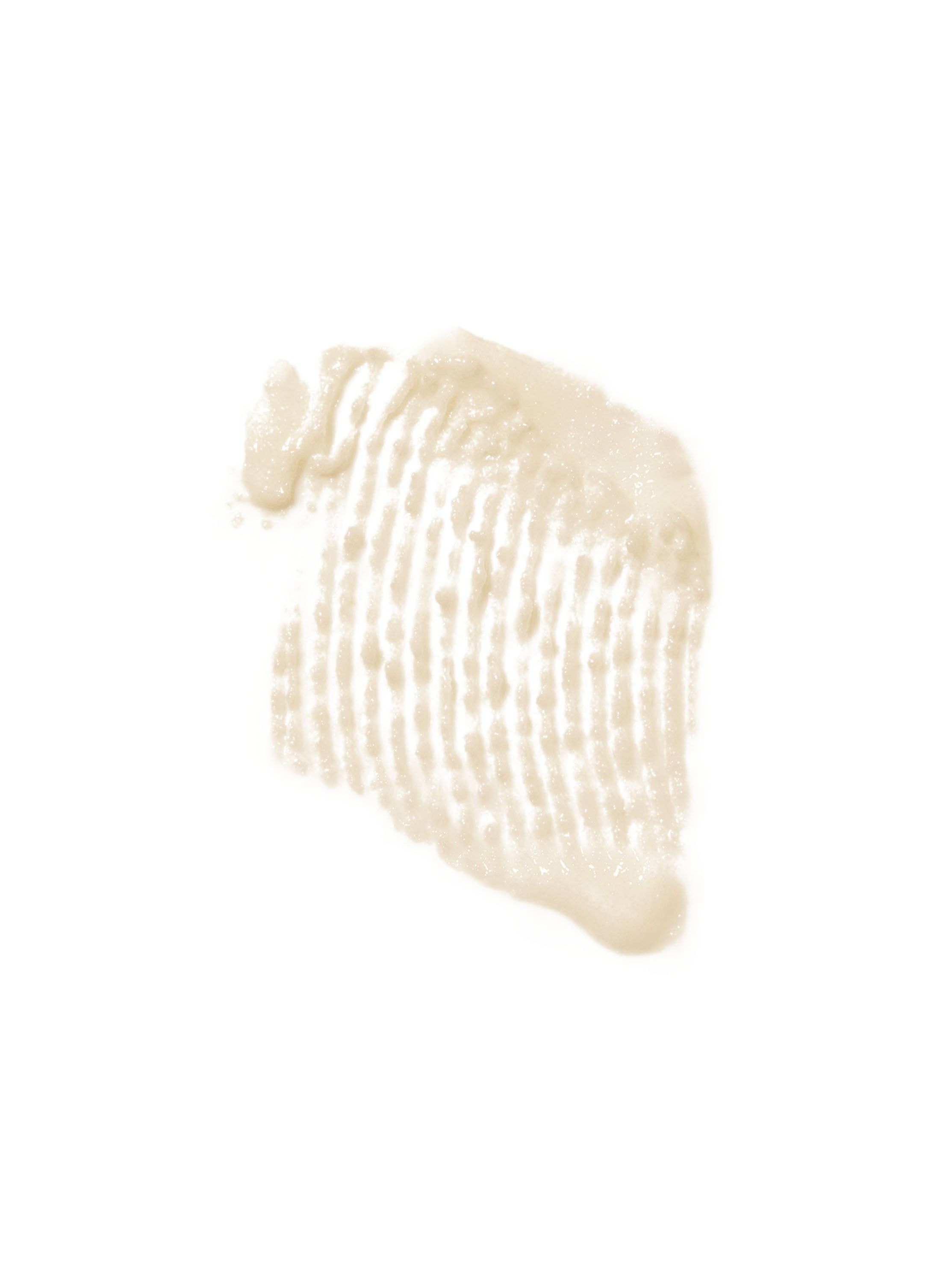 Exfoliant bej întins pe un fundal alb, cu o consistență granulară vizibilă, Bath & Body Works.