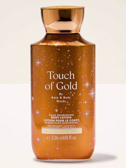 Balsam do ciała Touch of Gold Bath & Body Works w złotej butelce o rozświetlającej, nawilżającej formule.