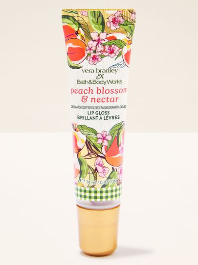 Bath & Body Works Peach Blossom & Nectar – błyszczyk do ust w tubce z brzoskwiniowo‑kwiatowym wzorem.