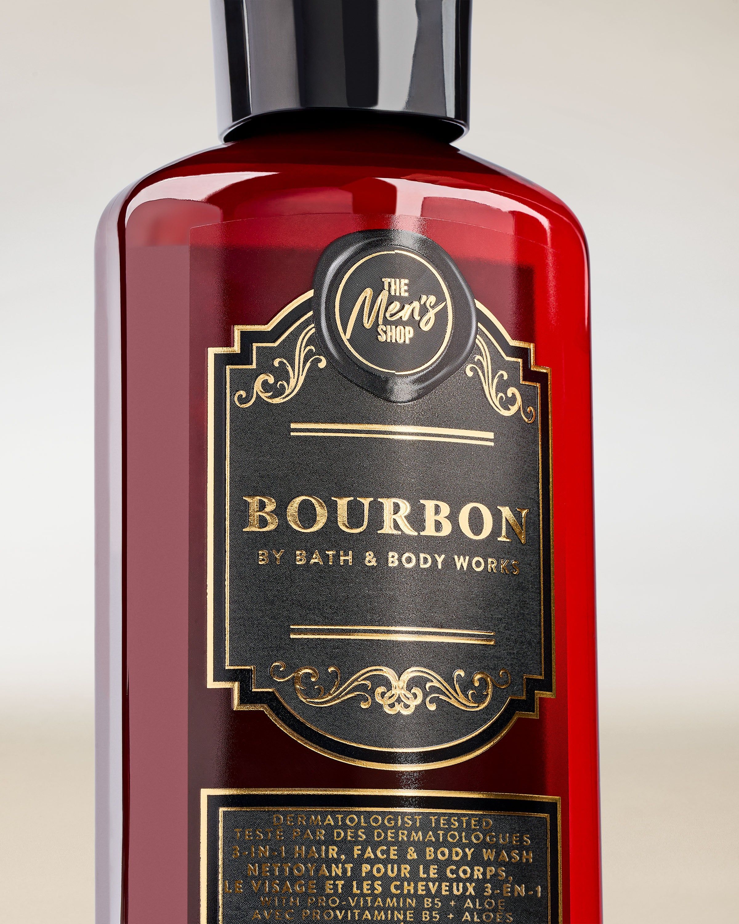 Bath & Body Works Bourbon – żel 3‑w‑1 do włosów, twarzy i ciała w ciemnym flakonie z ozdobną etykietą.