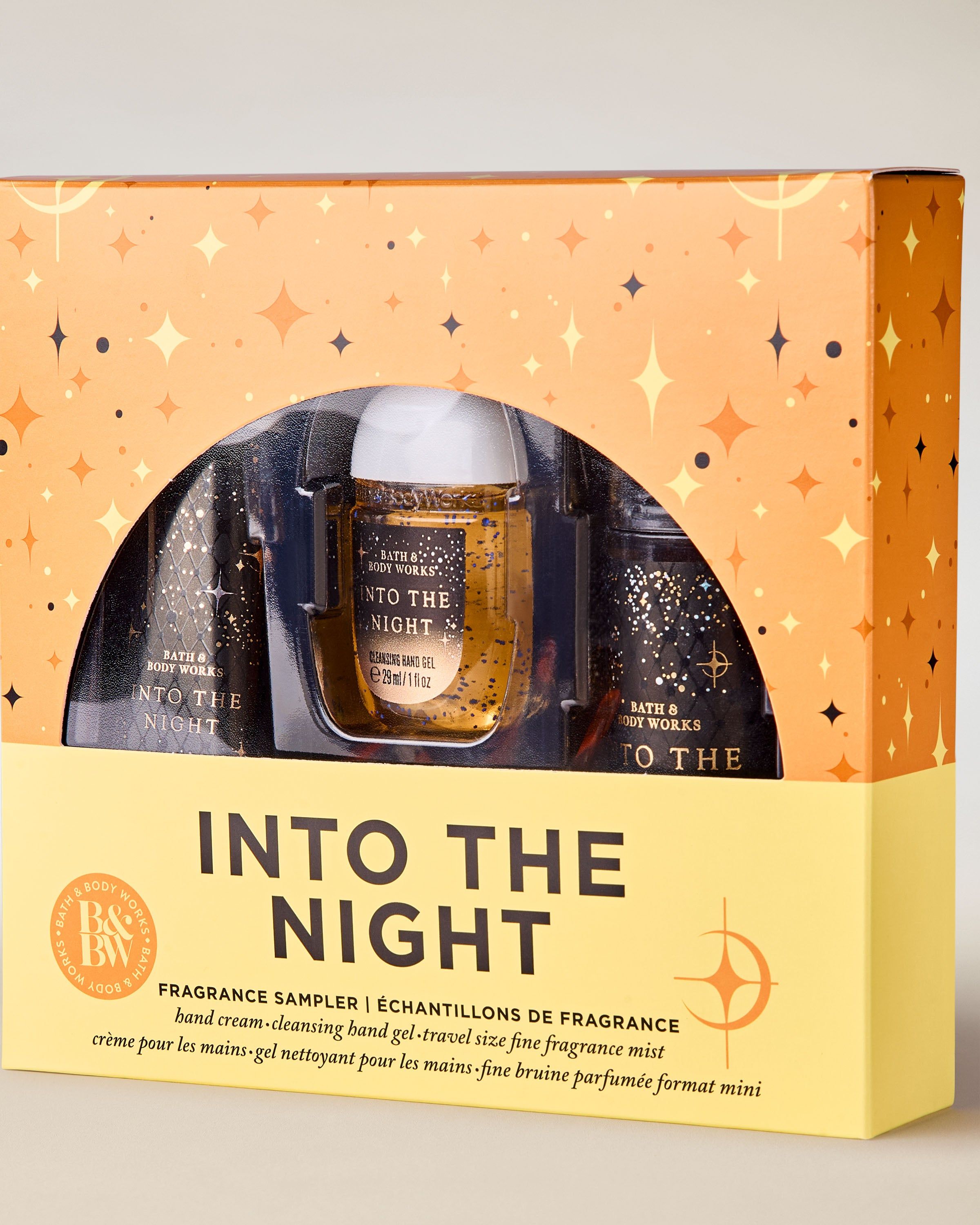 Zestaw Into the Night od Bath & Body Works w złoto‑czarnym pudełku – żel, krem i mgiełka w mini formacie.
