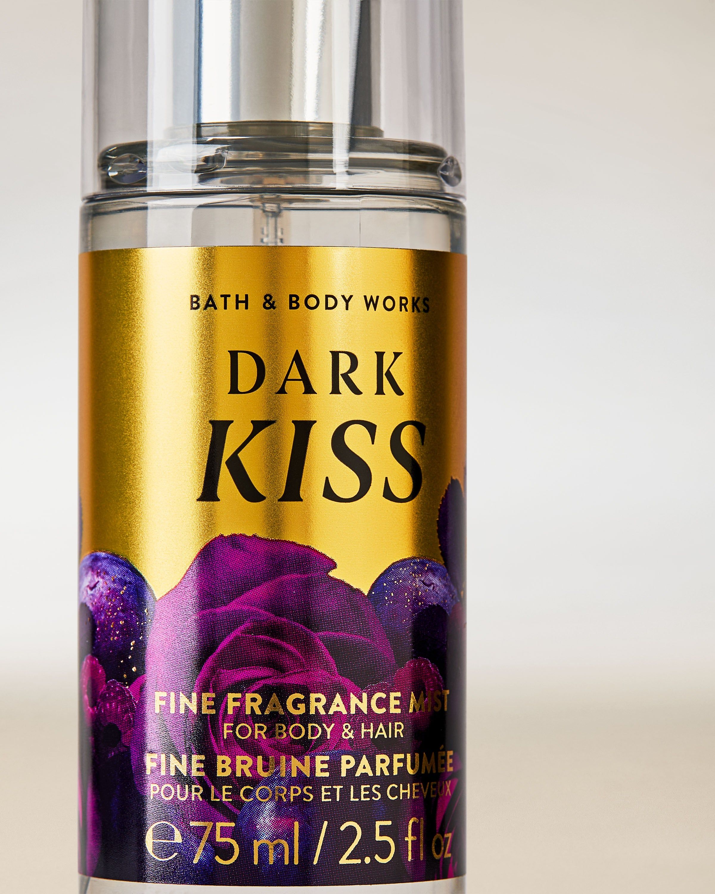 Mini mgiełka Dark Kiss w złoto‑fioletowej butelce z grafiką róż.