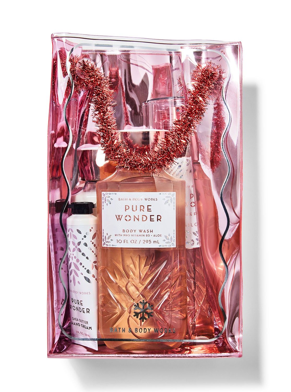 Set cadou „Pure Wonder” în geantă de cosmetice transparentă de culoare roz, cu ghirlandă, Bath & Body Works.