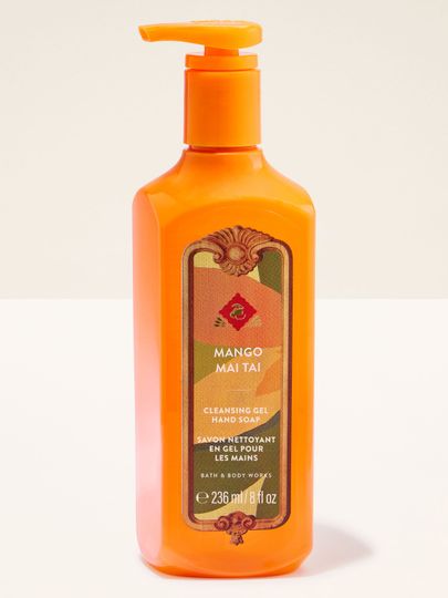 Mydło w żelu Bath & Body Works Mango Mai Tai w pomarańczowej butelce z tropikalną etykietą.