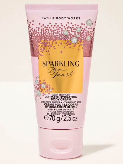 Mini krem do ciała Sparkling Toast Bath & Body Works w różowej tubie ze złotą, błyszczącą etykietą