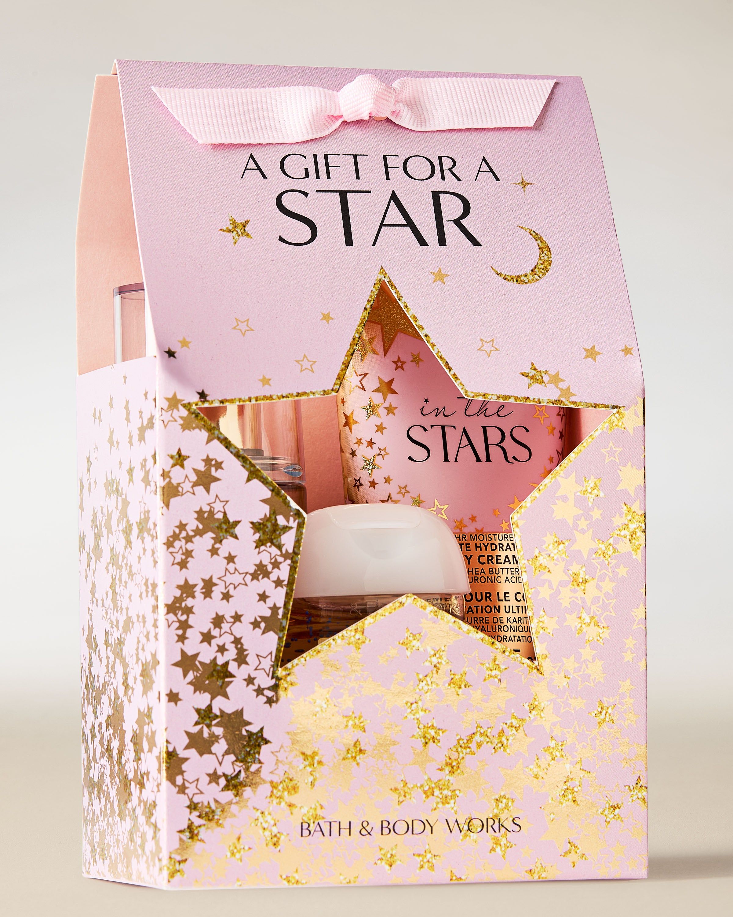 Opakowanie zestawu In the Stars od Bath & Body Works w różowo‑złotym, gwiezdnym designie z wyciętą gwiazdą.