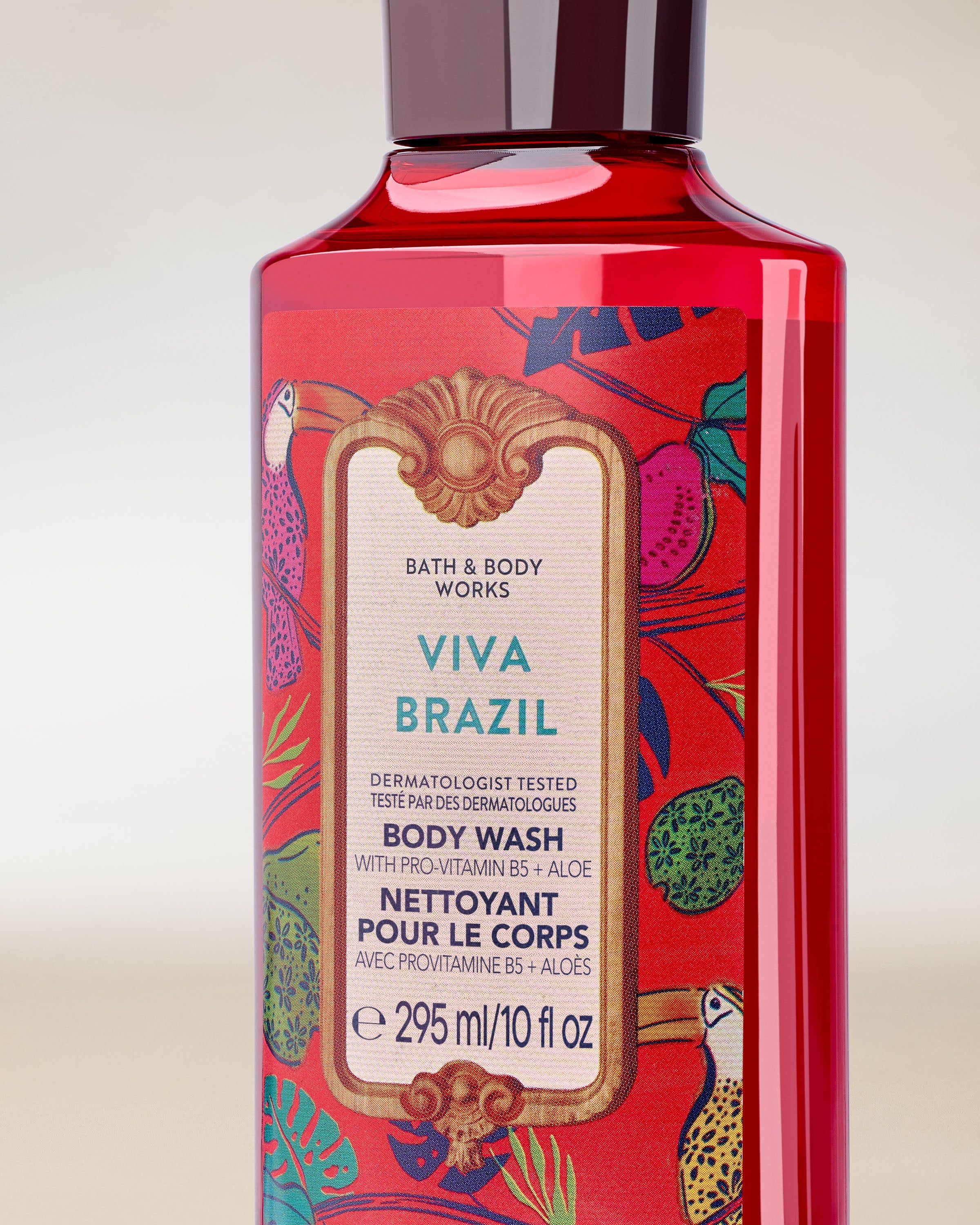 Żel pod prysznic Viva Brazil w czerwonej butelce z czarnym korkiem i kolorową, tropikalną etykietą.