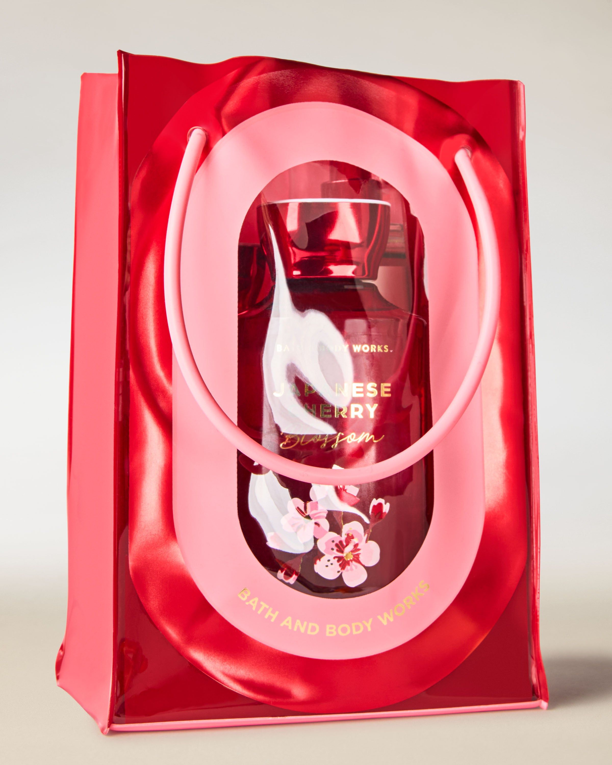 Torba prezentowa Japanese Cherry Blossom od Bath & Body Works w czerwono‑różowym, kwiatowym designie.