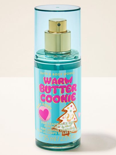 Perfumowana mgiełka do ciała Warm Butter Cookie Bath & Body Works w błękitnym flakonie z motywem choinkowego ciasteczka