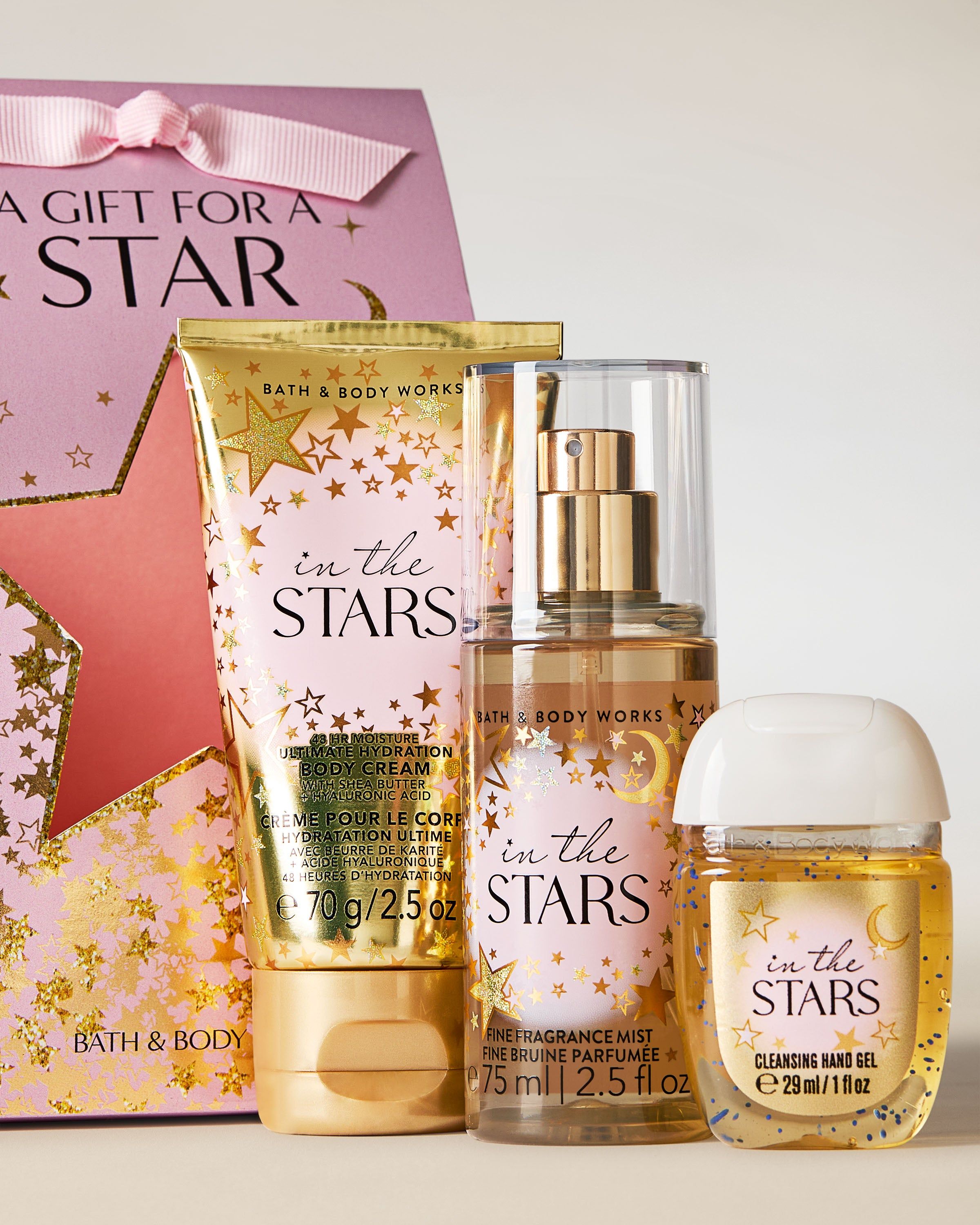 Zestaw In the Stars od Bath & Body Works – krem, mgiełka i żel w złoto‑różowym, gwiezdnym designie.
