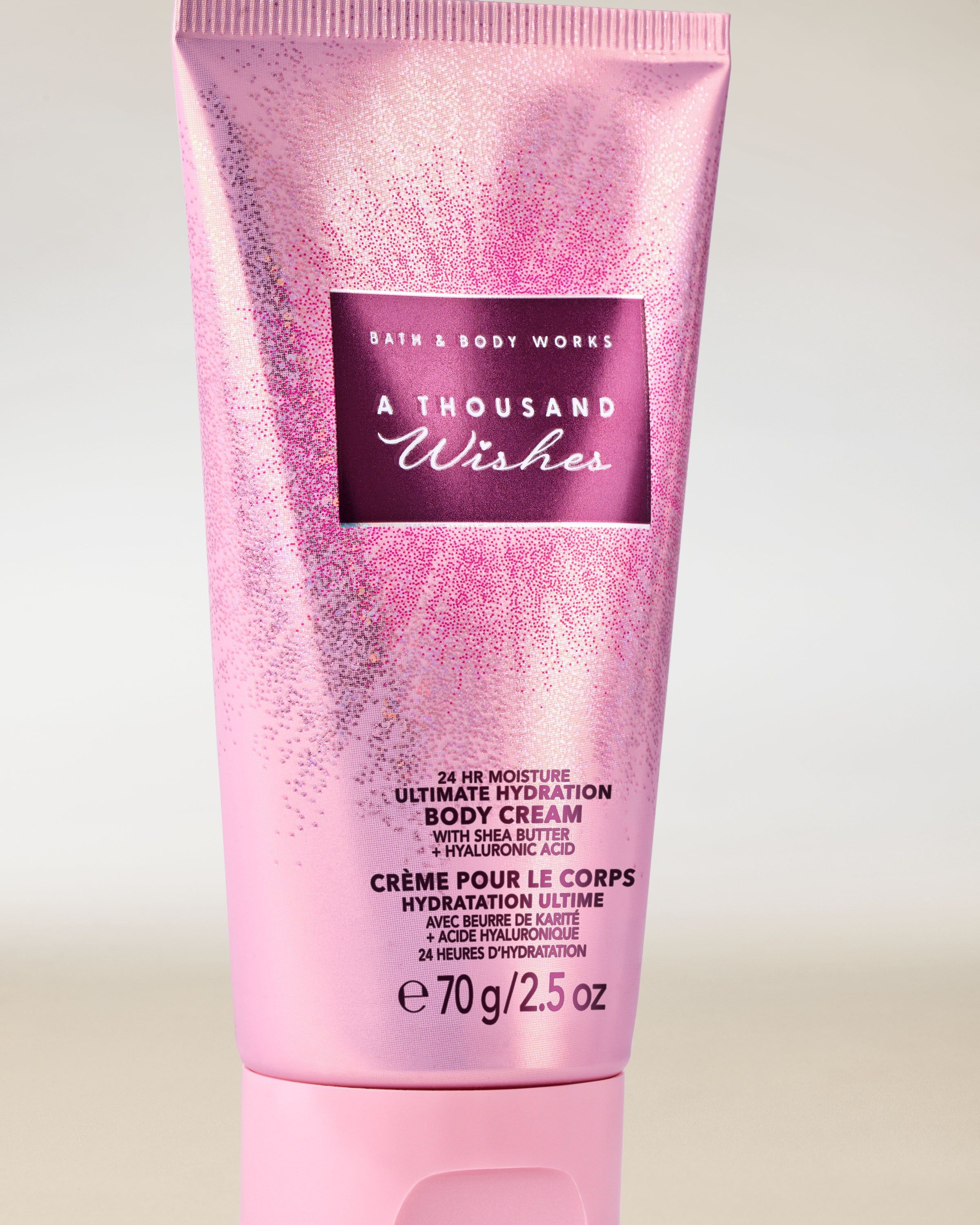 Krem do ciała Bath & Body Works A Thousand Wishes w różowej, błyszczącej tubie 70 g.