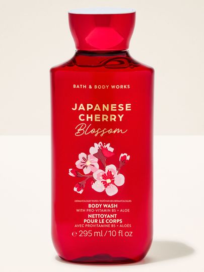 Żel pod prysznic Bath & Body Works "Japanese Cherry Blossom" w czerwonej butelce z grafiką kwitnącej wiśni.