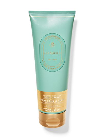 Krem do ciała Bath & Body Works Aromatherapy "Eucalyptus" w turkusowej tubce ze złotymi napisami i zakrętką.