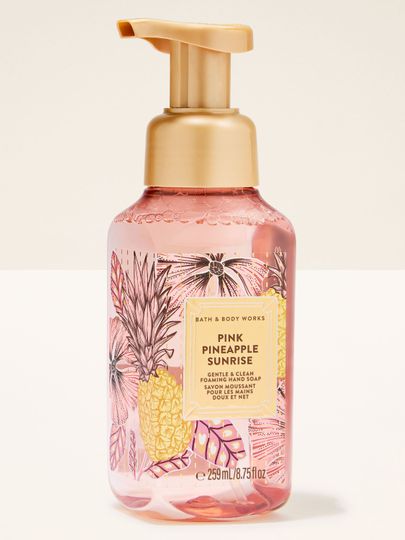 Pink Pineapple Sunrise – różowe mydło w piance z elegancką złotą pompką i tropikalną etykietą w ananasy.