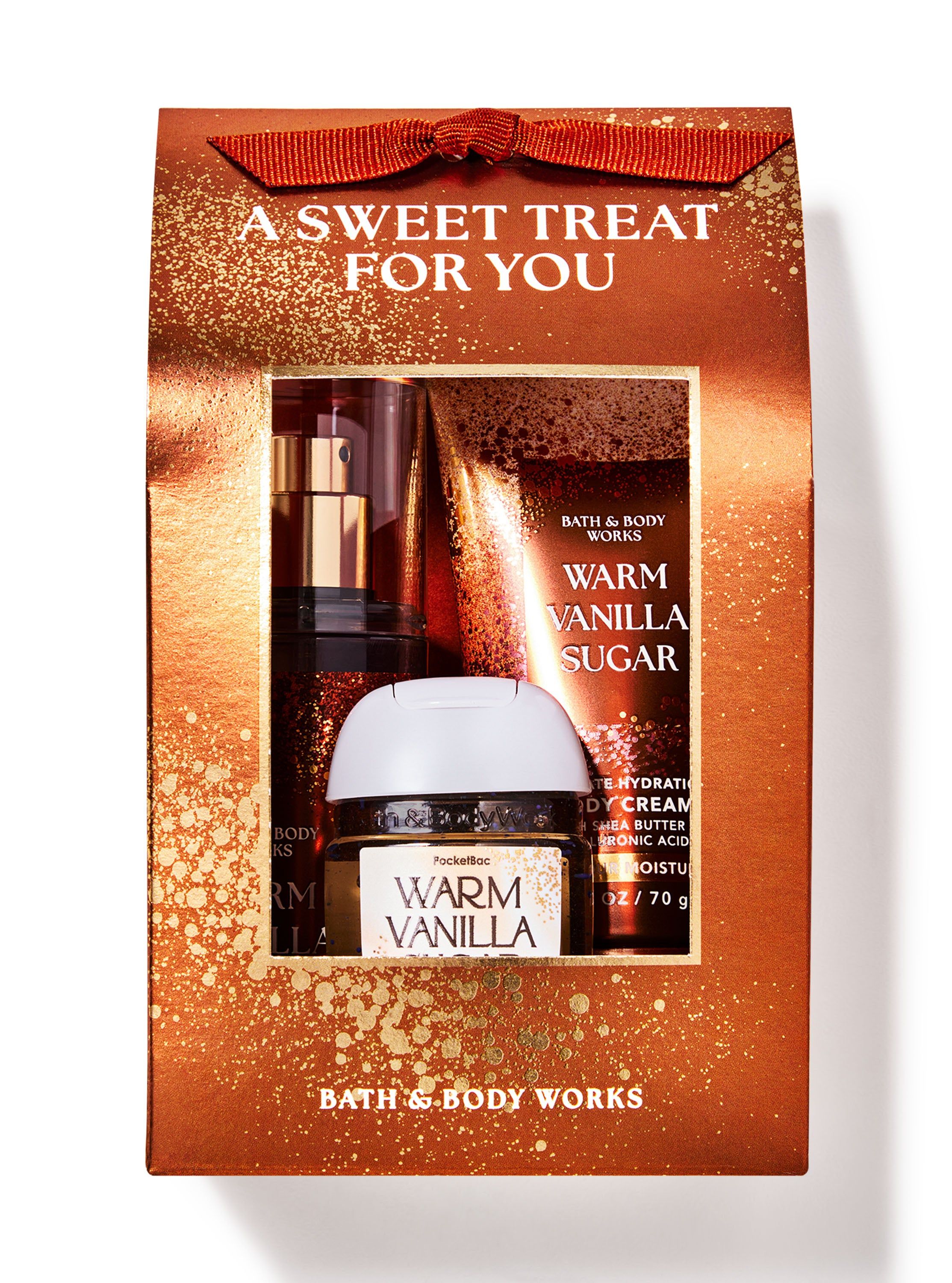 Zestaw prezentowy Warm Vanilla Sugar z mgiełką, kremem do ciała i żelem do rąk, zapakowany w dekoracyjne pudełko — gotowy do podarowania.