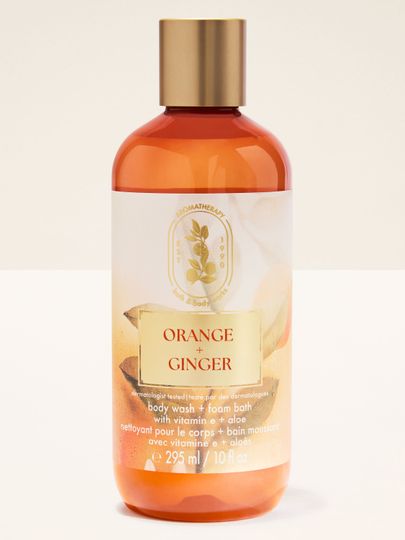 Żel pod prysznic Bath & Body Works Aromatherapy Orange + Ginger 295 ml w pomarańczowej butelce z zakrętką.