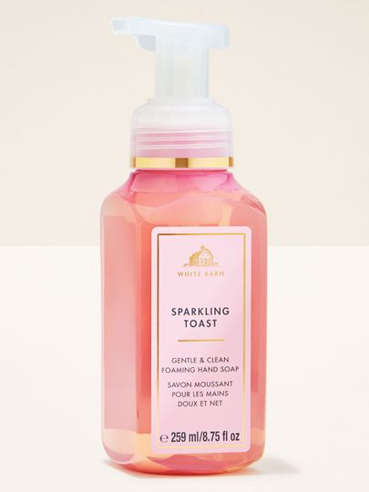 Pianka do rąk Sparkling Toast Bath & Body Works w różowej butelce z białą pompką i złotą etykietą
