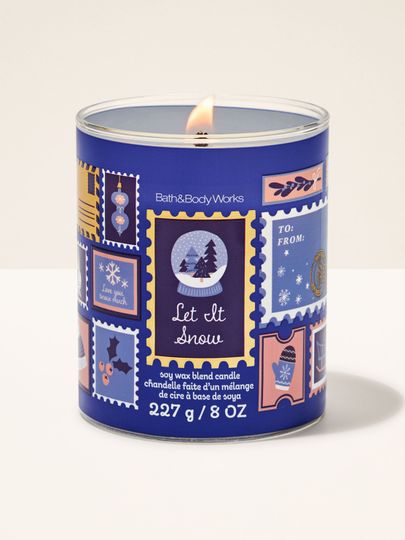 Świeca zapachowa Let It Snow Bath & Body Works z jednym płonącym knotem i motywem świątecznych znaczków