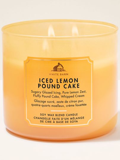 Świeca zapachowa 3‑knotowa White Barn Iced Lemon Pound Cake w matowym, żółtym szkle.