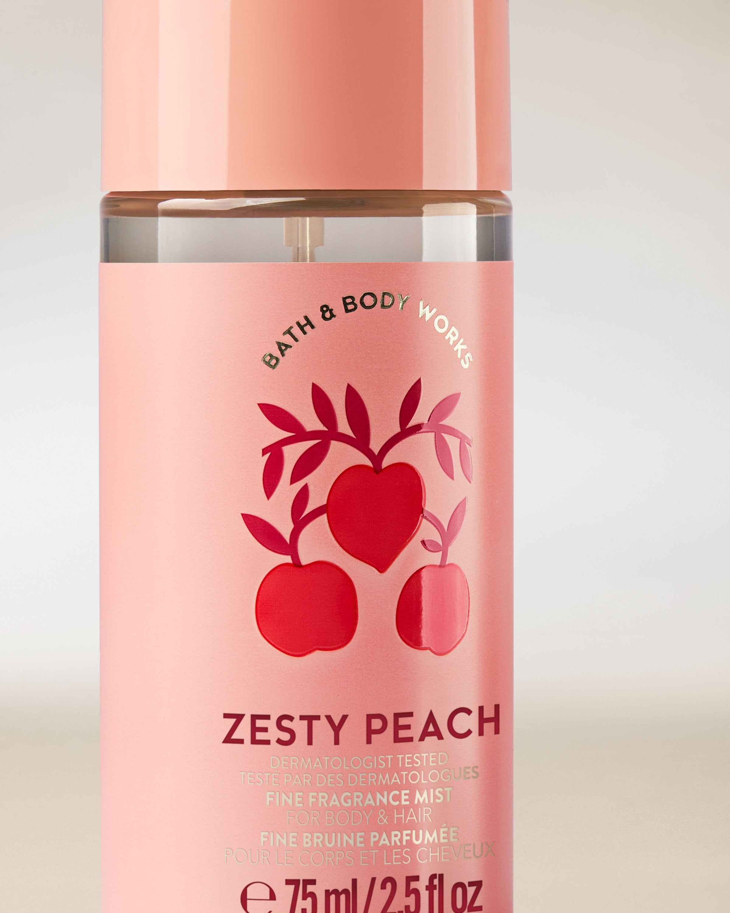 Perfumowana mgiełka do ciała i włosów Zesty Peach w różowej butelce